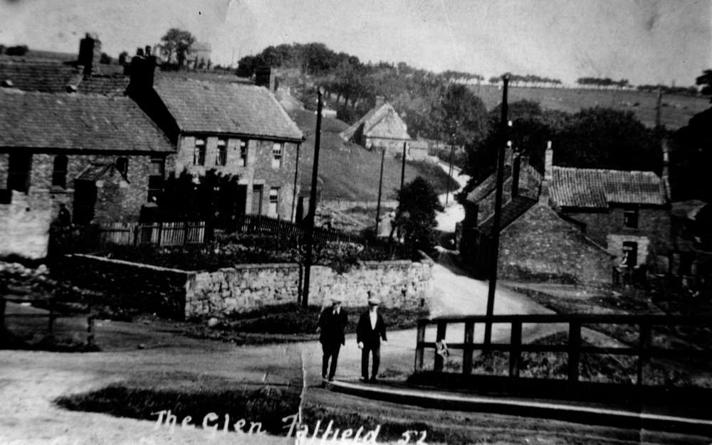 Late 19th/Early 20th Century photograph showing the village area of The Glen at Fatfield. Two men walking on the pavement.